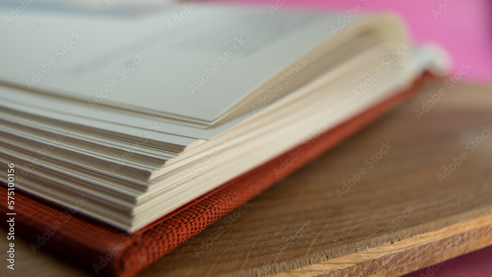 Fototapeta premium An open book lies on the table.