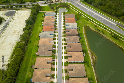 View from above of densely built residential houses in closed living clubs in south Florida. American dream homes as example of real estate development in US suburbs