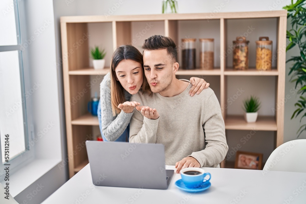 Man and woman couple hugging each other having video call at home Man and woman couple hugging each other having video call at home