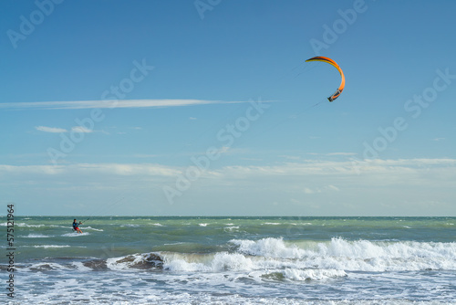 Solo Kitesurfing Adventure in the Blue Ocean Landscape with copy space