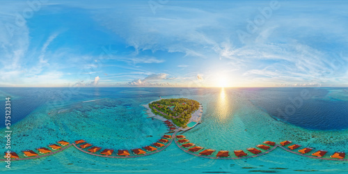 Luxurious overwater villas on Alimatha Island in the Maldives, Vaavu Atoll, at sunset. Aerial seamless 360 degree spherical panorama photo