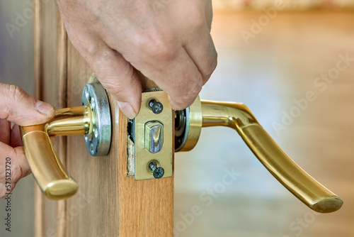 Lever door handle is installed in interior door of house. photo