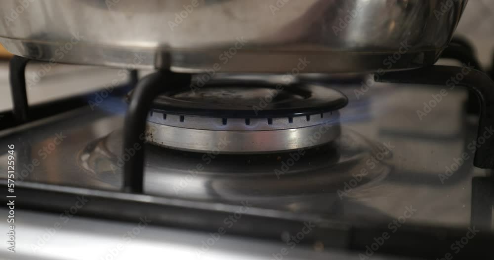 Preparing to Cook: Pot on Gas Stove Flame