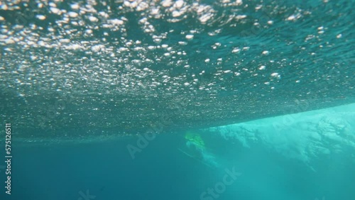 Surfer Practicing Surfing Seen From Wavy Undersea During Vacation - Thulusdhoo, Maldives photo