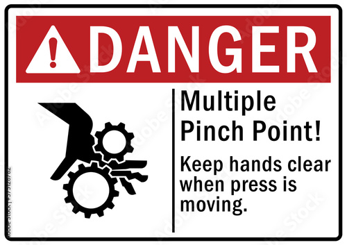 Pinch point hazard sign and labels keep hand clear when press is moving