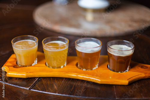 Test set of beer with a lots of different beers on background