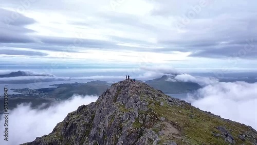 Aerial drone shot of people hiking in Lofoten, Norway in summer
