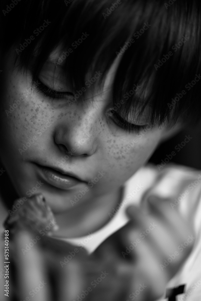 Portrait of boy with Red bearded Agama iguana. Little child playing with reptile. Selective focus. Black and white photography. High quality photo Portrait of boy with Red bearded Agama iguana. Little child playing with reptile. Selective focus. Black and white photography. High quality photo