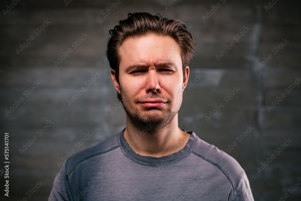 Young handsome man crying portrait