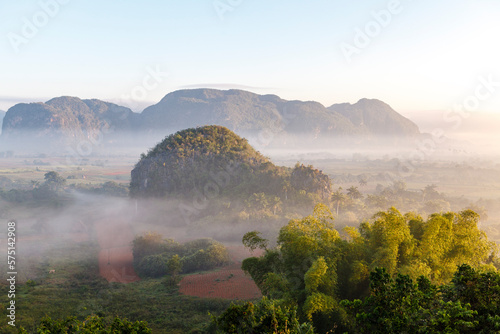 Morning fog over the Valley of Viñales with its big mogotes mountains, an Unesco World Heritage Site in Cuba, Caribbean photo