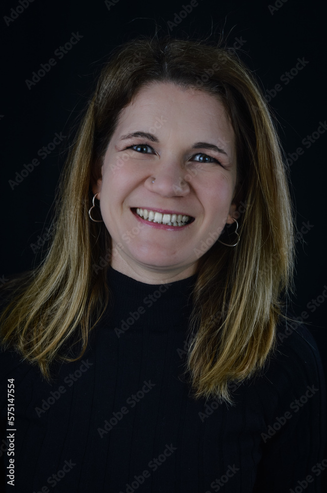 portrait of a beautiful blonde woman who is naturally smiling in a very friendly way portrait of a beautiful blonde woman who is naturally smiling in a very friendly way