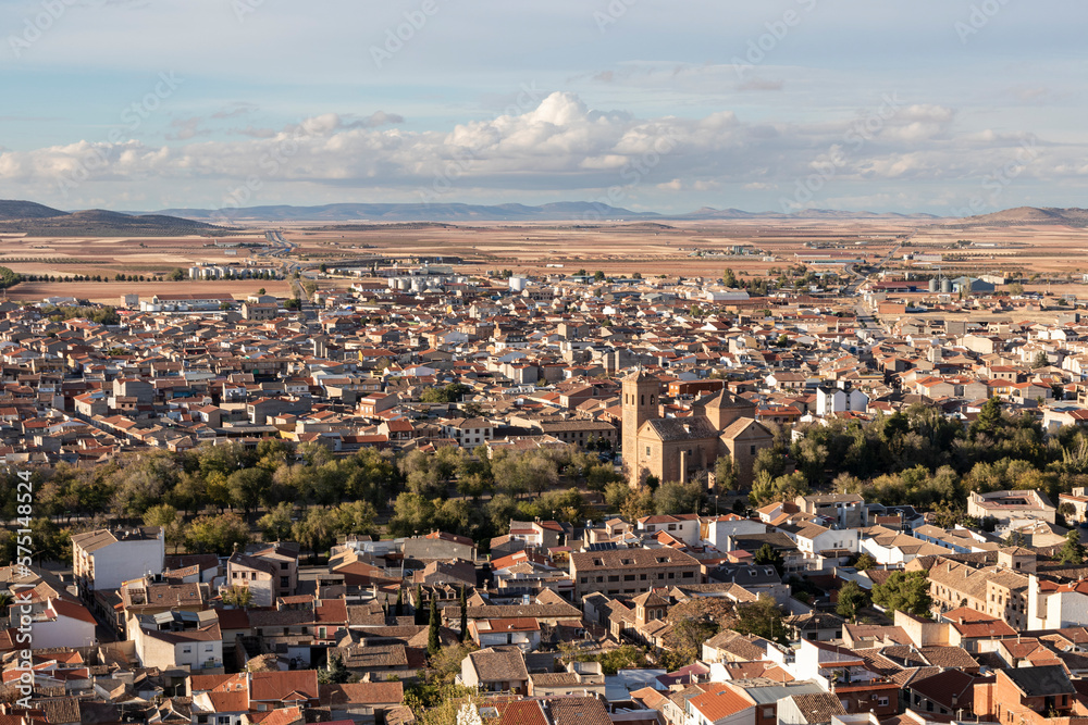 Aerial panoramic view over the orange tile roofs to a small spanish town village Consuegra
