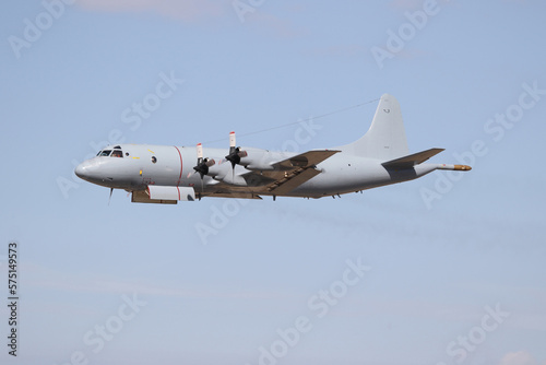 Big military transportation aircraft in the air. Lockheed P-3.
