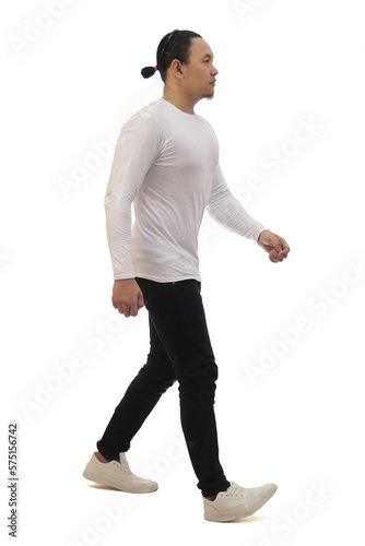 Asian man wearing casual white shirt black denim and white shoes, walking forward, side view, happy confidence expression. Full body portrait isolated © airdone
