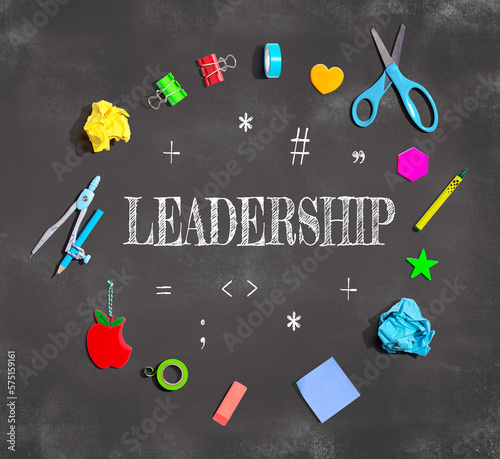 Leadership with school supplies on a chalkboard - flat lay