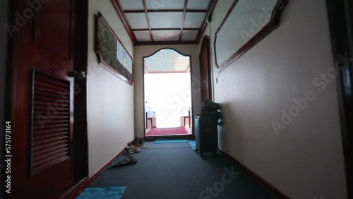 Slow Motion Shot Of Footwear And Luggage Outside Rooms In Ship - Thulusdhoo, Maldives photo