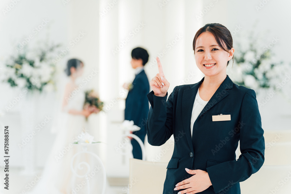 結婚式場・ホテルで働くウェディングプランナー・介添人・アテンダー・ホテリエの女性
結婚式場・ホテルで働くウェディングプランナー・介添人・アテンダー・ホテリエの女性