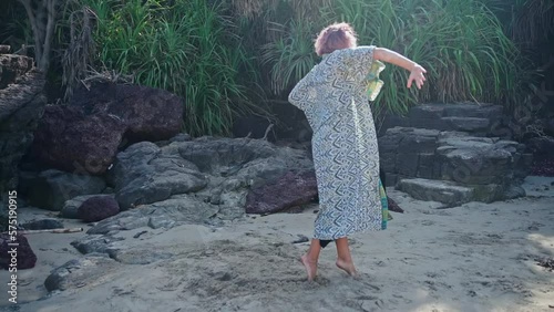 A woman dances against the background of nature,causing admiration for the dance