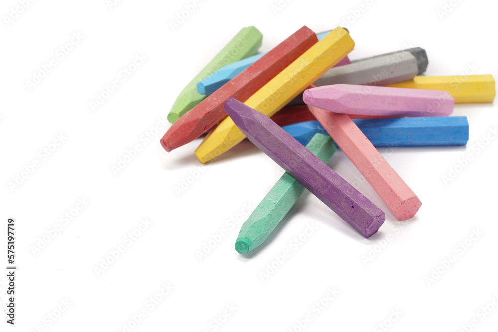 A pile of colorful oil pastels on a white background
