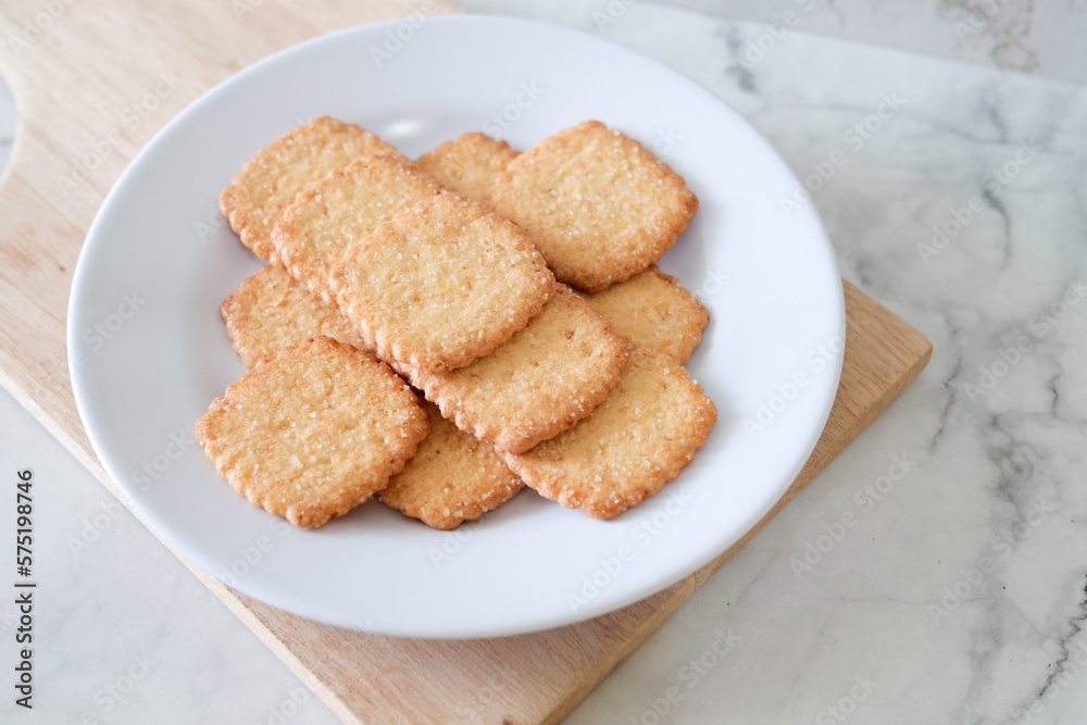 Potato chips biscuit on a white plate. Delicious crispy potato chips biscuits in plate. Space for text. Top view. Sweet potato buttermilk biscuits homemade for breakfast Potato chips biscuit on a white plate. Delicious crispy potato chips biscuits in plate. Space for text. Top view. Sweet potato buttermilk biscuits homemade for breakfast