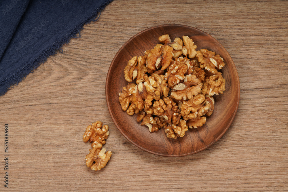plate of peeled walnuts plate of peeled walnuts