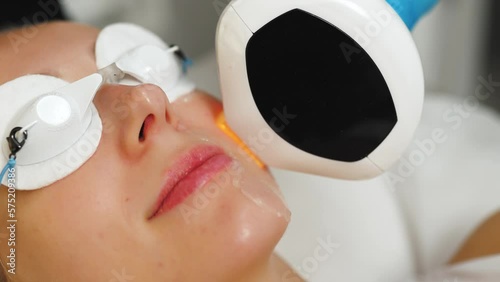 Closeup woman face with eyes covered during thermolifting process spa treatment. High quality 4k footage photo