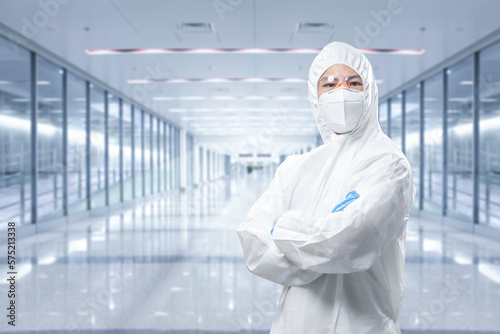 Fotografi Worker wears medical protective suit or coverall suit with mask and goggles