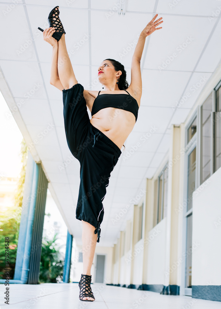Dance girl doing flexibility in high heels. Woman dancer in heels doing  yoga flexibilities. Dance artist woman doing acrobatics and flexibilities  in heels. Artistic gymnastics concept Stock-Foto | Adobe Stock