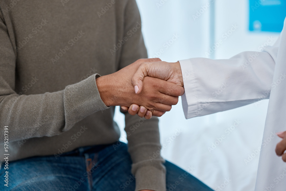 Fototapeta premium Closeup, handshake and doctor with man, healthcare and appointment for diagnosis, cure and results. Zoom, hand and medical professional with male patient, schedule for procedure and appreciation