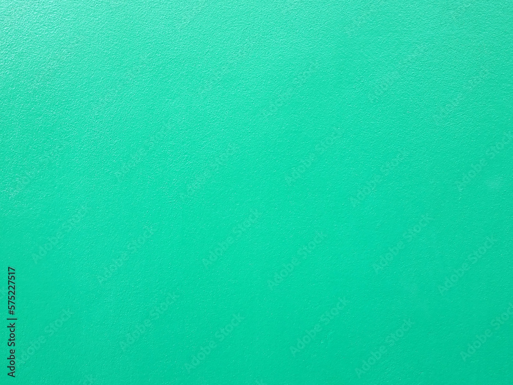 pastel green paint on rough concrete floor or wall texture background
