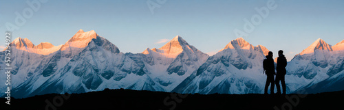 Silhouette of two person on top of mountain peak. / Holding Hands / coaching goal, success and teamwork concepts - Mountains Mountaineer / Space for Text / Blank Space / Copy Text