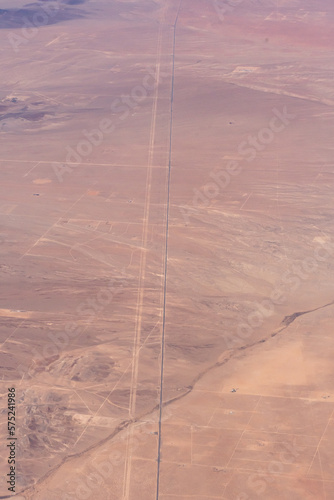 Aerial view of a desert road and land parcels photo