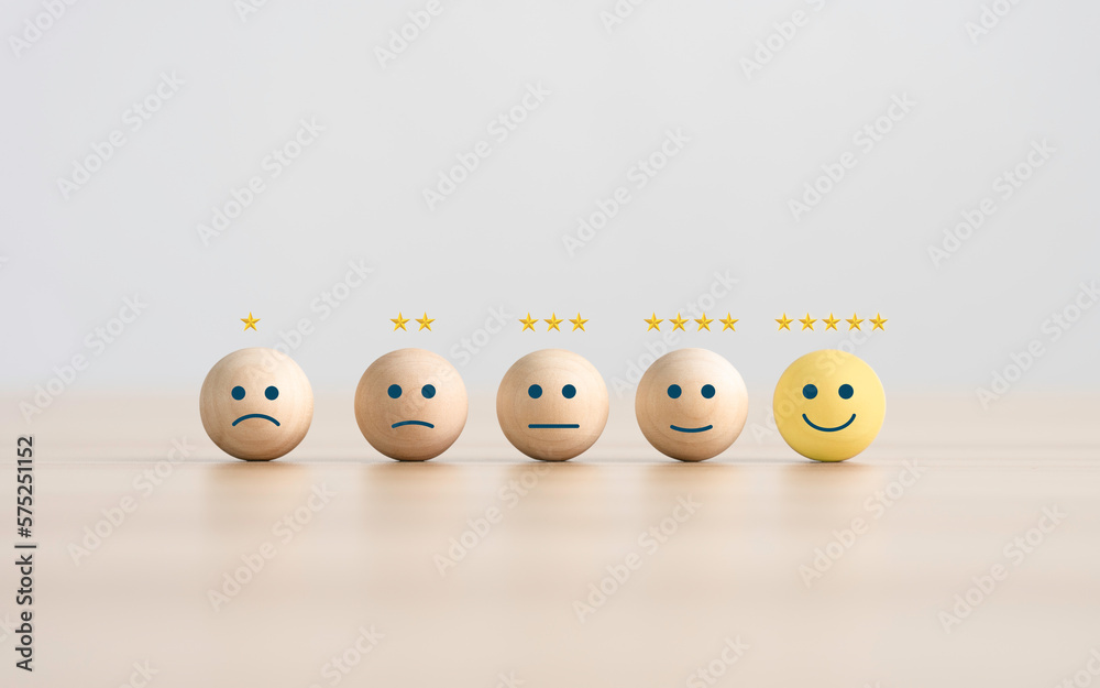the happy face smile face icon on a wooden cube for Customer service evaluation customer satisfaction level and satisfaction survey concepts. - obrazy, fototapety, plakaty 