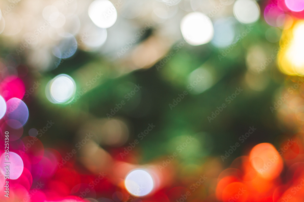 Obraz premium Closeup of Christmas tree background with bokeh light beautiful color variety. Christmas and New Year holiday background. Backgrounds that can be added to letters or can be used as advertising images.