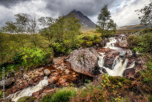 Waterfall on the River Coupall with Buachaille Etive Mor mountain in the background. Glencoe, Scotland. photo