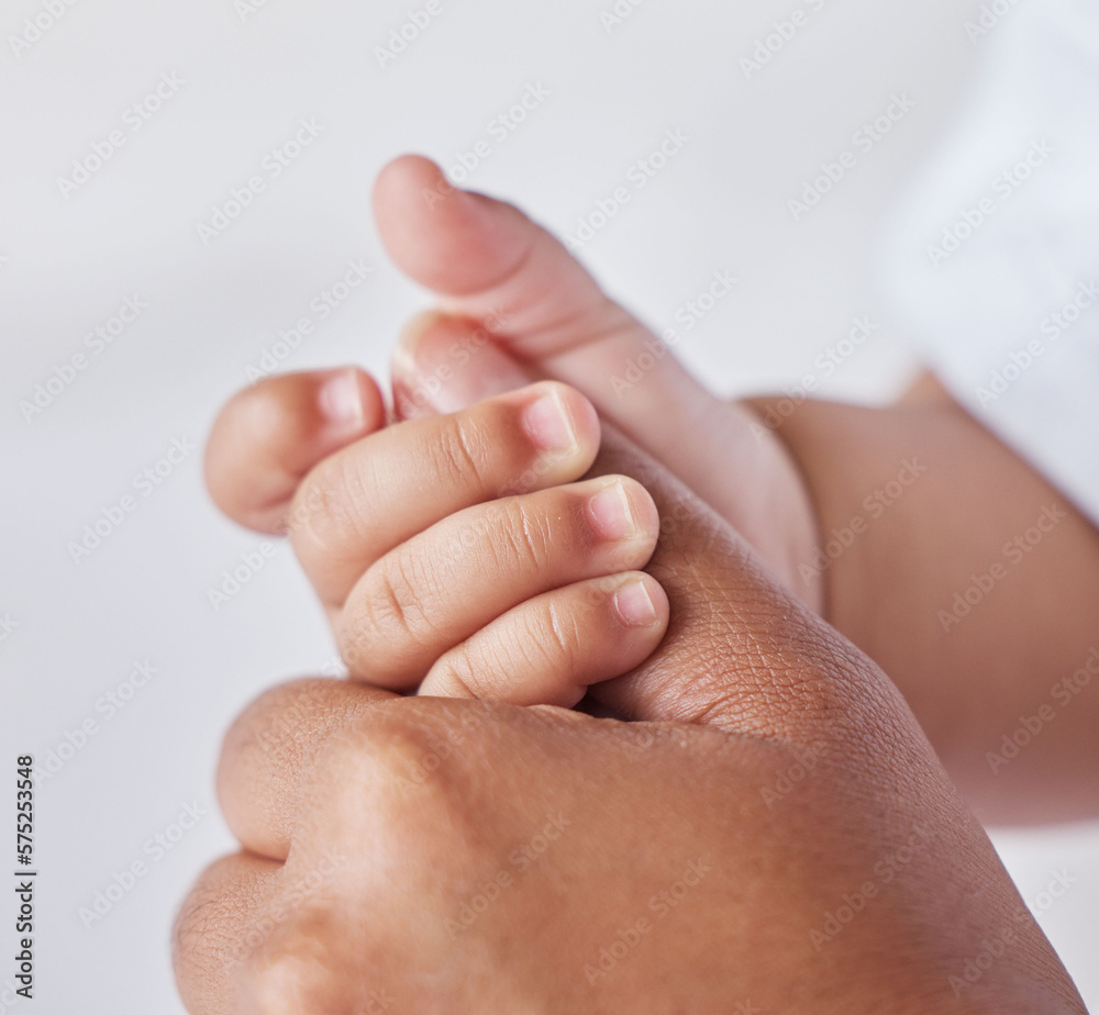 Closeup, hands and mother with baby, love and support for care, health and wellness on studio background. Zoom, hand and mama with infant, protection and child development with bonding and maternity Closeup, hands and mother with baby, love and support for care, health and wellness on studio background. Zoom, hand and mama with infant, protection and child development with bonding and maternity