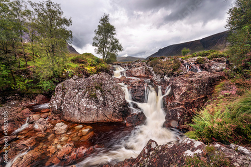 Waterfall on the River Coupall near Buachaille Etive Mor mountain, Glencoe, Scotland photo