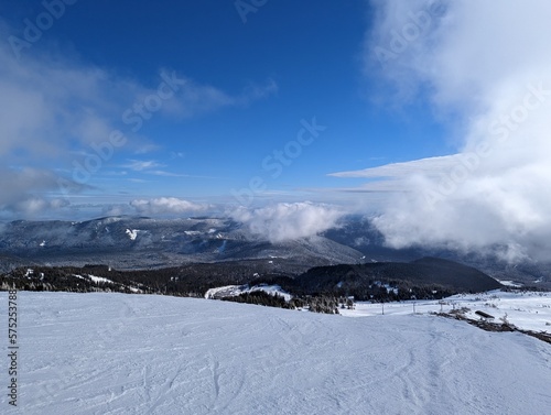 Snowy mountain range in the clouds © Alex