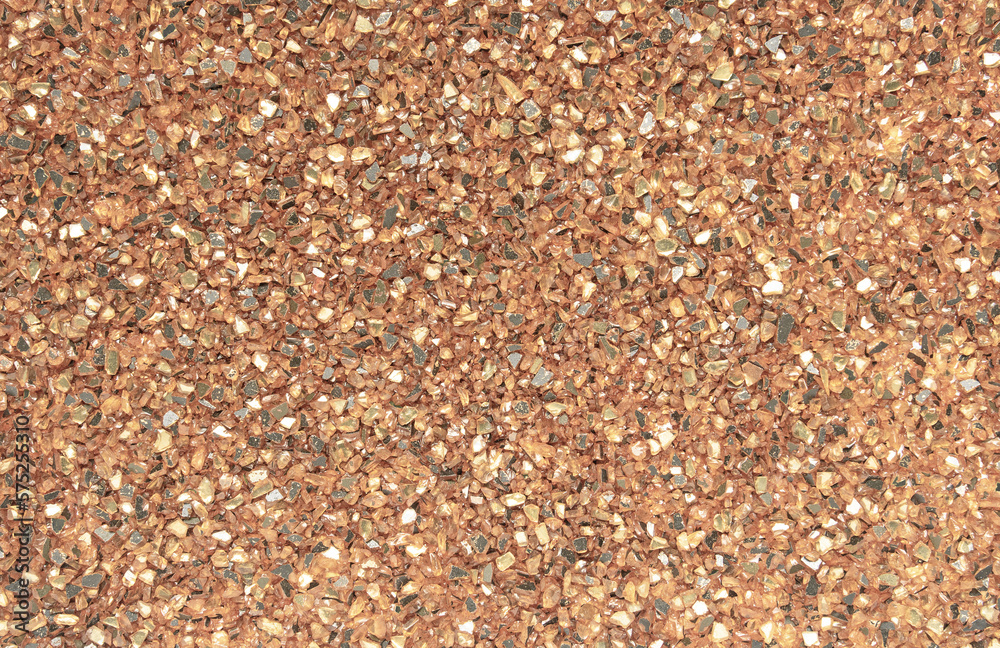 Abstract blurred background of small pebbles in orange and brown Abstract blurred background of small pebbles in orange and brown