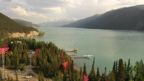 Aerial, Lodge (hotel, motel, cabins) on lakeshore. Services along the Alaska Highway. Travel, adventure, journey concept. Northern Rocky Mountains, Muncho Lake Park in British Columbia, Canada photo