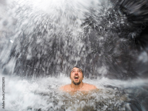 Man swimming in Gaviao Waterfall in Serra do Cipo National Park, Minas Gerais, Brazil photo