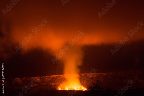 Lava in Halemaumau Crater in Hawaii Volcanoes National Park glows at night. photo
