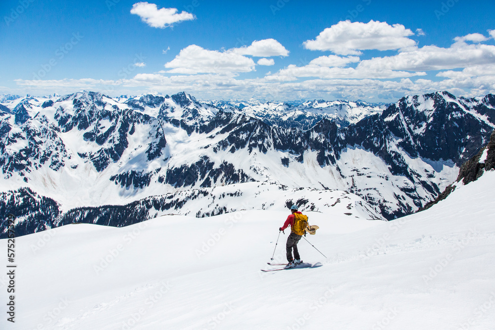 Man skiing down slope of Sahale Peak, North Cascades National Park, Washington State, USA Man skiing down slope of Sahale Peak, North Cascades National Park, Washington State, USA