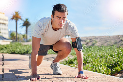 Running, fitness and start with man and race in outdoors for health, sports and marathon training. Workout, exercise and performance with runner and ready for speed, wellness and fast challenge