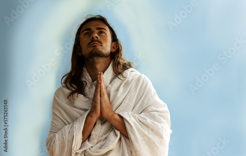 Obraz na płótnie Man praying who looks like holy Jesus created using generative AI w salonie