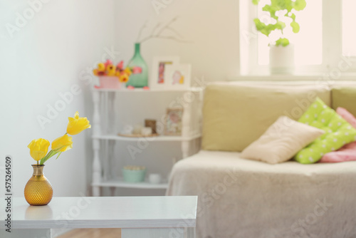 white home interior with spring flowers and decorations