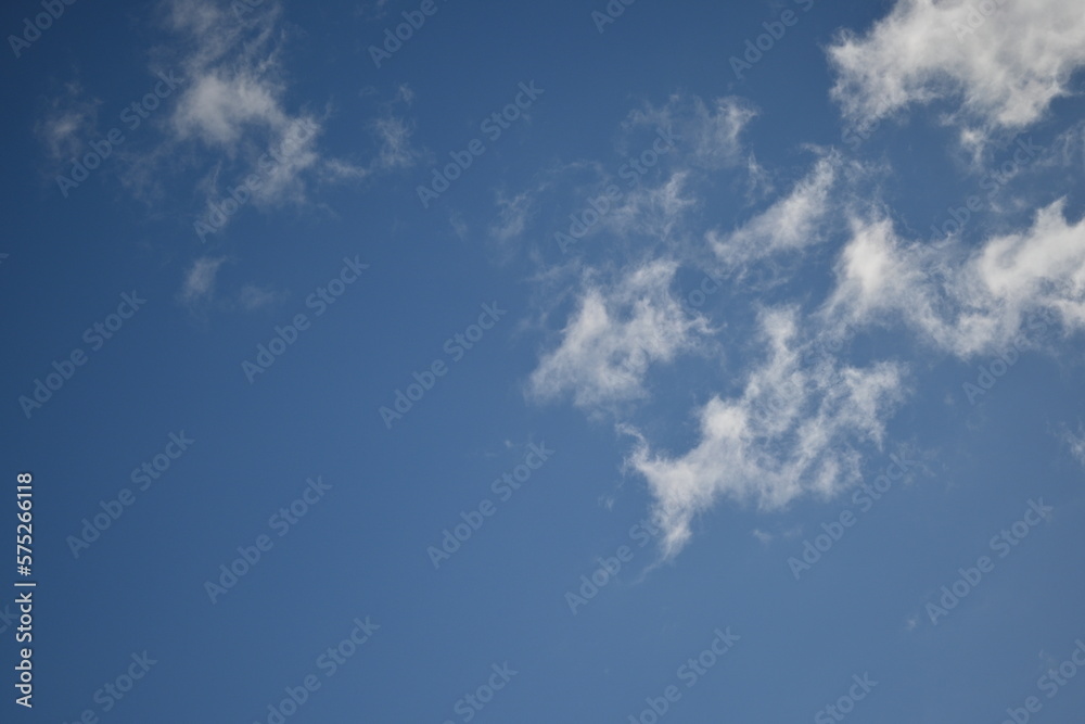 spring white clouds against the blue sky background summer cloudy sky spring white clouds against the blue sky background summer cloudy sky