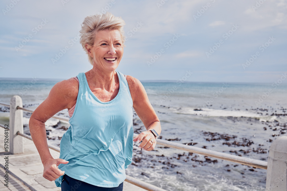 Senior woman, fitness and running at beach promenade, sky mockup and energy of health, wellness and workout. Elderly female, exercise and runner at ocean for happy sports, cardio training or marathon - obrazy, fototapety, plakaty 