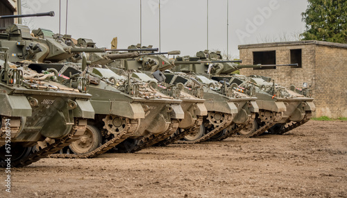 Fotografija a row of five British army Warrior FV510 fighting vehicles ready for military de