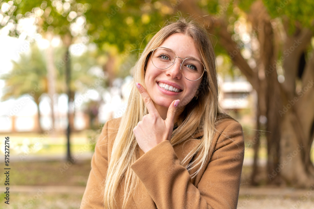 Young pretty blonde woman at outdoors smiling Young pretty blonde woman at outdoors smiling